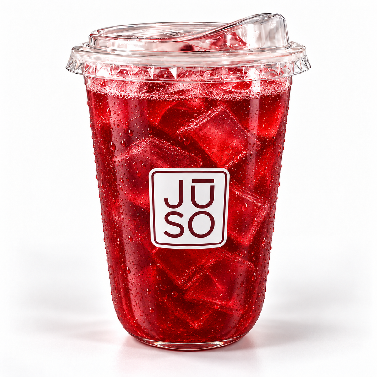 JŪSO Pomegranate Pure Press served over ice in a branded clear cup with a matching sip lid