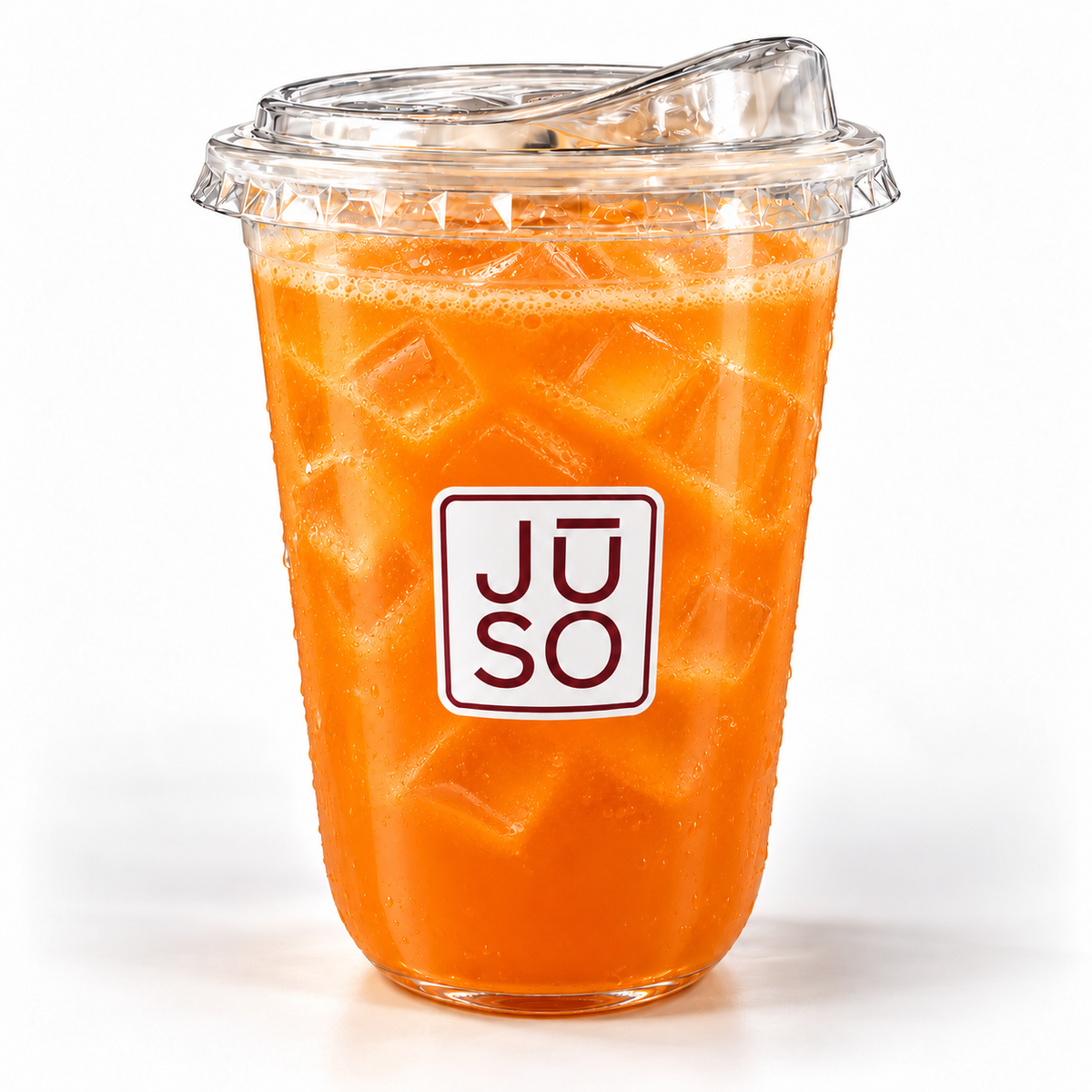 JŪSO Carrot Pure Press served over ice in a branded clear cup with a matching sip lid