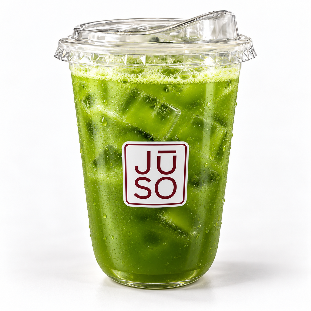 JŪSO Green Flag green juice served over ice in a branded clear cup