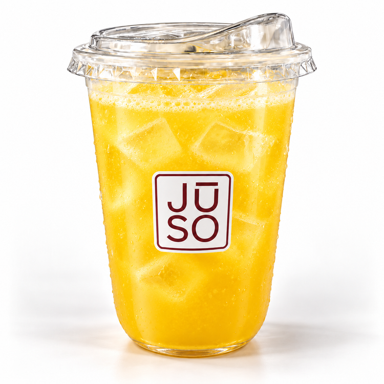 JŪSO Pineapple Pure Press served over ice in a branded clear cup with a matching sip lid